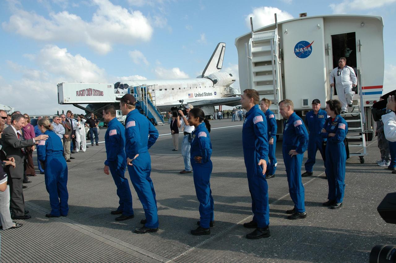 KENNEDY SPACE CENTER, FLA. --  The STS-120 crew exit the crew transport vehicle to be greeted by NASA Administrator Mike Griffin and others.  Griffin is at left, talking to Commander Pamela Melroy.  Behind her, from left are Pilot George Zamka and mission specialists Scott Parazynski, Stephanie Wilson and Doug Wheelock.  Behind Wheelock is Chief of the Astronaut Corps Steven Lindsey and Director of Flight Crew Operations Ellen Ochoa, both from Johnson Space Center.  The crew completed a 15-day mission to the International Space Station with a smooth landing on Runway 33.  Main gear touchdown was 1:01:16 p.m.  Wheel stop was at 1:02:07 p.m.  Mission elapsed time was 15 days, 2 hours, 24 minutes and 2 seconds.  Mission STS-120 continued the construction of the station with the installation of the Harmony Node 2 module and the relocation of the P6 truss. Photo credit: NASA/Jim Grossmann