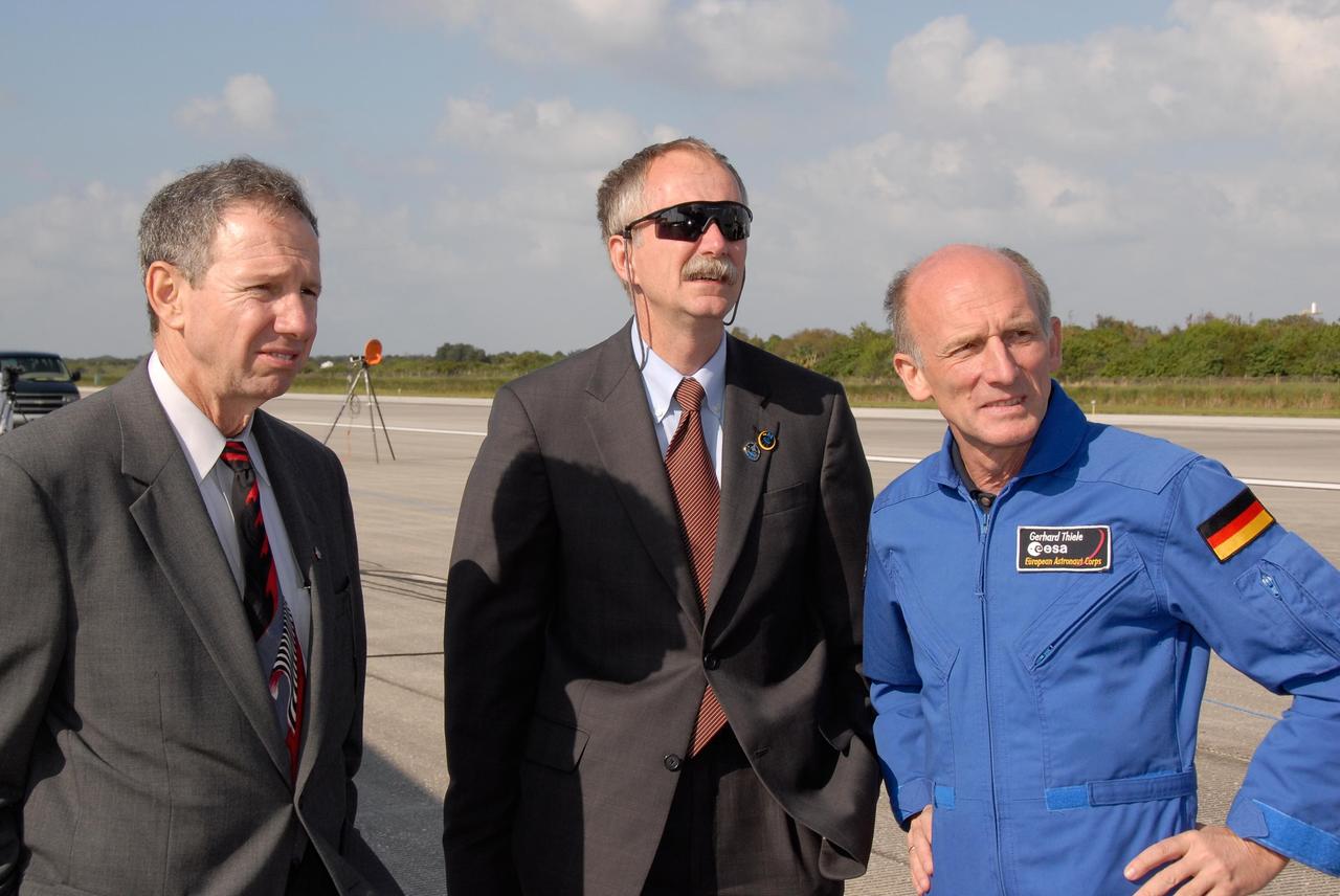 KENNEDY SPACE CENTER, FLA. --  At NASA's Kennedy Space Center, NASA Administrator Mike Griffin, Associate Administrator for NASA Space Operations William Gerstenmaier and European Space Agency astronaut Gerhard Thiele wait to greet the crew of space shuttle Discovery when they exit the crew transport vehicle.  Discovery completed the 15-day mission STS-120, with an on-time landing at 1:01:16 p.m.  Wheel stop was at 1:02:07 p.m.  Mission elapsed time was 15 days, 2 hours, 24 minutes and 2 seconds.  Mission STS-120 continued the construction of the station with the installation of the Harmony Node 2 module and the relocation of the P6 truss. Photo credit: NASA//Kim Shiflett