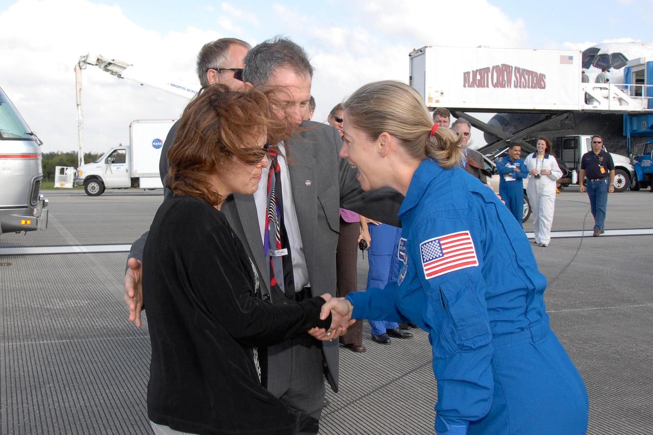 KENNEDY SPACE CENTER, FLA. --  STS-120 Commander Pamela Melroy is greeted by NASA Administrator Mike Griffin and his wife, Rebecca Griffin.  Melroy and the Discovery crew completed the 15-day mission STS-120, with an on-time landing at 1:01:16 p.m.  Wheel stop was at 1:02:07 p.m.  Mission elapsed time was 15 days, 2 hours, 24 minutes and 2 seconds.Mission STS-120 continued the construction of the station with the installation of the Harmony Node 2 module and the relocation of the P6 truss. Photo credit: NASA//Kim Shiflett