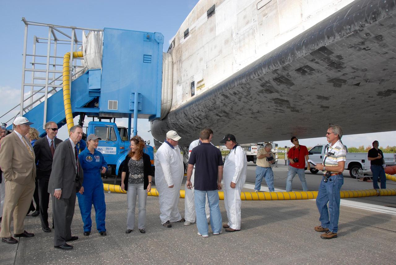 KENNEDY SPACE CENTER, FLA. --   At center, STS-120 Commander Pamela Melroy begins a checkout of space shuttle Discovery.  With her are, from left, Shuttle Program Manager Wayne Hale, Associate Administrator for NASA Space Operations William Gerstenmaier and NASA Administrator Mike Griffin.  On the right is Rebecca Griffin, wife of the administrator. Melroy and the Discovery crew completed the 15-day mission STS-120, with an on-time landing at 1:01:16 p.m.  Wheel stop was at 1:02:07 p.m.  Mission elapsed time was 15 days, 2 hours, 24 minutes and 2 seconds.  Mission STS-120 continued the construction of the station with the installation of the Harmony Node 2 module and the relocation of the P6 truss. Photo credit: NASA/Kim Shiflett
