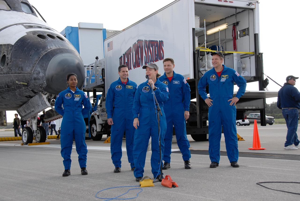 KENNEDY SPACE CENTER, FLA. --   STS-120 Commander Pamela Melroy talks to media and guests on the Shuttle Landing Facility at NASA's Kennedy Space Center after landing space shuttle Discovery.  Behind her are (from left) mission specialist Stephanie Wilson, Pilot George Zamka and mission specialists Doug Wheelock and Scott Parazynski.  The Discovery crew completed the 15-day mission STS-120, with an on-time landing at 1:01:16 p.m.  Wheel stop was at 1:02:07 p.m.  Mission elapsed time was 15 days, 2 hours, 24 minutes and 2 seconds.  Mission STS-120 continued the construction of the station with the installation of the Harmony Node 2 module and the relocation of the P6 truss. Photo credit: NASA/Kim Shiflett