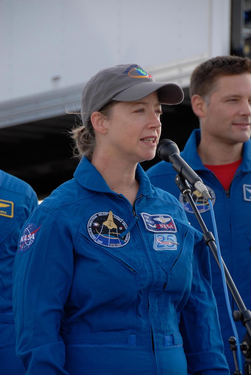KENNEDY SPACE CENTER, FLA. --   STS-120 Commander Pamela Melroy talks to media and guests on the Shuttle Landing Facility at NASA's Kennedy Space Center after landing space shuttle Discovery. Seen at right is mission specialist Doug Wheelock.  The Discovery crew completed mission STS-120 with an on-time landing at 1:01:16 p.m.  Wheel stop was at 1:02:07 p.m.  Mission elapsed time was 15 days, 2 hours, 24 minutes and 2 seconds.  Mission STS-120 continued the construction of the station with the installation of the Harmony Node 2 module and the relocation of the P6 truss. Photo credit: NASA/Kim Shiflett