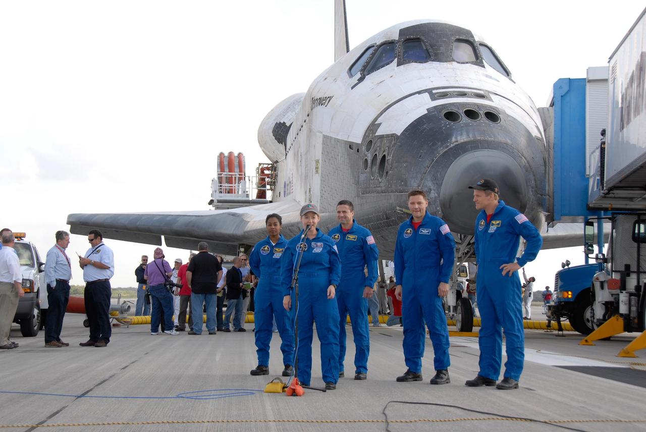 KENNEDY SPACE CENTER, FLA. --   STS-120 Commander Pamela Melroy talks to media and guests on the Shuttle Landing Facility at NASA's Kennedy Space Center after landing space shuttle Discovery.  Behind her are (from left) mission specialist Stephanie Wilson, Pilot George Zamka and mission specialists Doug Wheelock and Scott Parazynski.  The Discovery crew completed the 15-day mission STS-120, with an on-time landing at 1:01:16 p.m.  Wheel stop was at 1:02:07 p.m.  Mission elapsed time was 15 days, 2 hours, 24 minutes and 2 seconds.  Mission STS-120 continued the construction of the station with the installation of the Harmony Node 2 module and the relocation of the P6 truss. Photo credit: NASA/Kim Shiflett