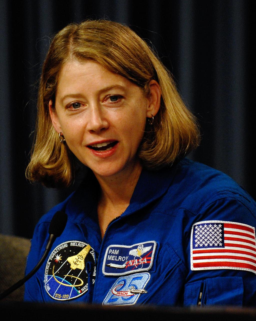 KENNEDY SPACE CENTER, FLA. --   STS-120 Commander Pamela Melroy takes part in a news conference after the crew's successful landing aboard space shuttle Discovery at NASA's Kennedy Space Center.  The crew completed a 15-day mission to the International Space Station with a smooth landing on Runway 33.  Main gear touchdown was 1:01:16 p.m.  Wheel stop was at 1:02:07 p.m.  Mission elapsed time was 15 days, 2 hours, 24 minutes and 2 seconds.  Mission STS-120 continued the construction of the station with the installation of the Harmony Node 2 module and the relocation of the P6 truss. Photo credit: NASA/Kim Shiflett