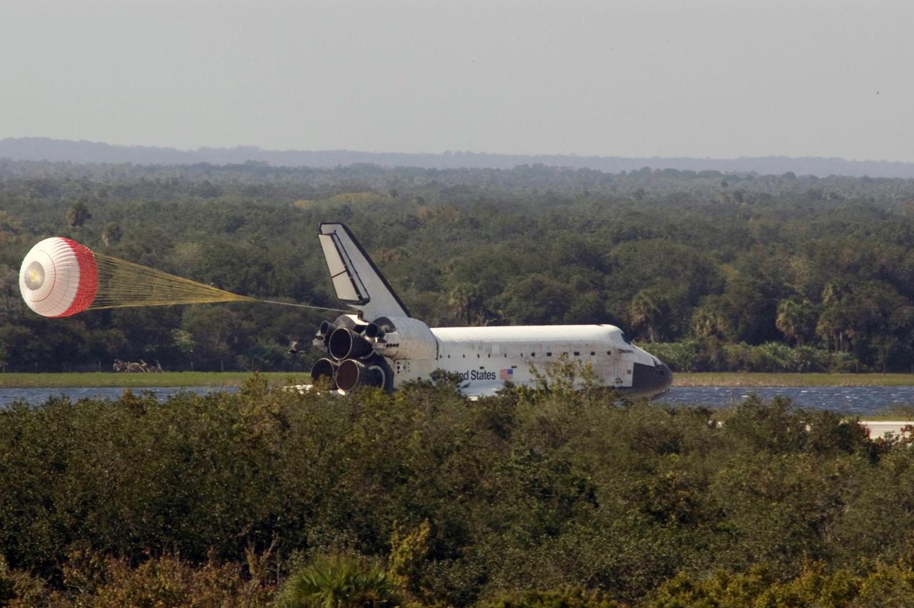 KENNEDY SPACE CENTER, FLA. --   The drag chute deployed behind space shuttle Discovery helps slow its smooth landing on Runway 33 of the Shuttle Landing Facility at NASA's Kennedy Space Center, completing the 15-day mission STS-120.  Main gear touchdown was 1:01:16 p.m.  Wheel stop was at 1:02:07 p.m. Mission elapsed time was 15 days, 2 hours, 24 minutes and 2 seconds. Mission STS-120 continued the construction of the station with the installation of the Harmony Node 2 module and the relocation of the P6 truss. Photo credit: NASA/Scott Haun