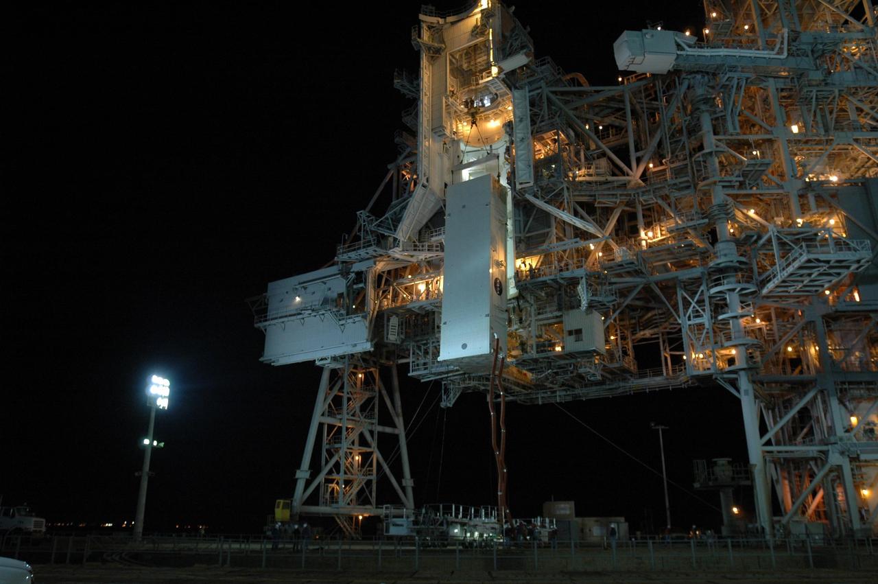 KENNEDY SPACE CENTER, FLA. -- The payload canister containing the Columbus Laboratory module and integrated cargo carrier-lite is lifted up toward the payload changeout room on Launch Pad 39A at NASA's Kennedy Space Center.  Once in place, the canister will be opened and the cargo transferred inside the payload changeout room. The payload will be installed in space shuttle Atlantis' payload bay.The canister contains the Columbus Lab module and integrated cargo carrier-lite payloads for space shuttle Atlantis on mission STS-122.  Atlantis is targeted to launch on Dec. 6.  Photo credit: NASA/Dimitri Gerondidakis