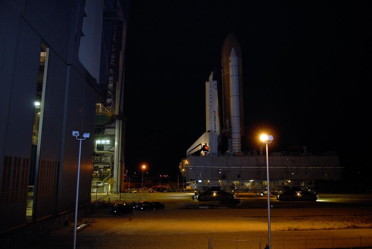 KENNEDY SPACE CENTER, FLA. -- Space Shuttle Atlantis has cleared the doors of the high bay of the Vehicle Assembly Building and begins its trek along the crawlerway to Launch Pad 39A. First motion out of the VAB was at 4:43 a.m. EST. Rollout is a milestone for Atlantis' launch to the International Space Station on mission STS-122, targeted for Dec. 6. On this mission, Atlantis will deliver the Columbus module to the International Space Station. The European Space Agency's largest contribution to the station, Columbus is a multifunctional, pressurized laboratory that will be permanently attached to U.S. Node 2, called Harmony. The module is approximately 23 feet long and 15 feet wide, allowing it to hold 10 large racks of experiments. The laboratory will expand the research facilities aboard the station, providing crew members and scientists from around the world the ability to conduct a variety of experiments in the physical, materials and life sciences. Photo credit: NASA/Kim Shiflett