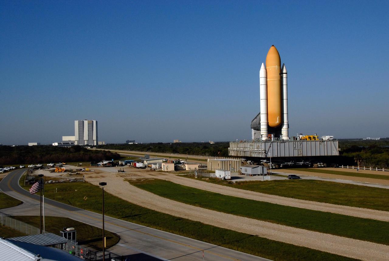 KENNEDY SPACE CENTER, FLA. -- Space Shuttle Atlantis, secured atop a mobile launch platform, passes by the crawler kraal in Launch Complex 39 on its way to Pad A. This area is used to perform maintenance on the crawler transporter. First motion out of the Vehicle Assembly Building was at 4:43 a.m. EST.  Rollout is a milestone for Atlantis' launch to the International Space Station on mission STS-122, targeted for Dec. 6. On this mission, Atlantis will deliver the Columbus module to the International Space Station. The European Space Agency's largest contribution to the station, Columbus is a multifunctional, pressurized laboratory that will be permanently attached to U.S. Node 2, called Harmony. The module is approximately 23 feet long and 15 feet wide, allowing it to hold 10 large racks of experiments. The laboratory will expand the research facilities aboard the station, providing crew members and scientists from around the world the ability to conduct a variety of experiments in the physical, materials and life sciences.   Photo credit: NASA/Kim Shiflett
