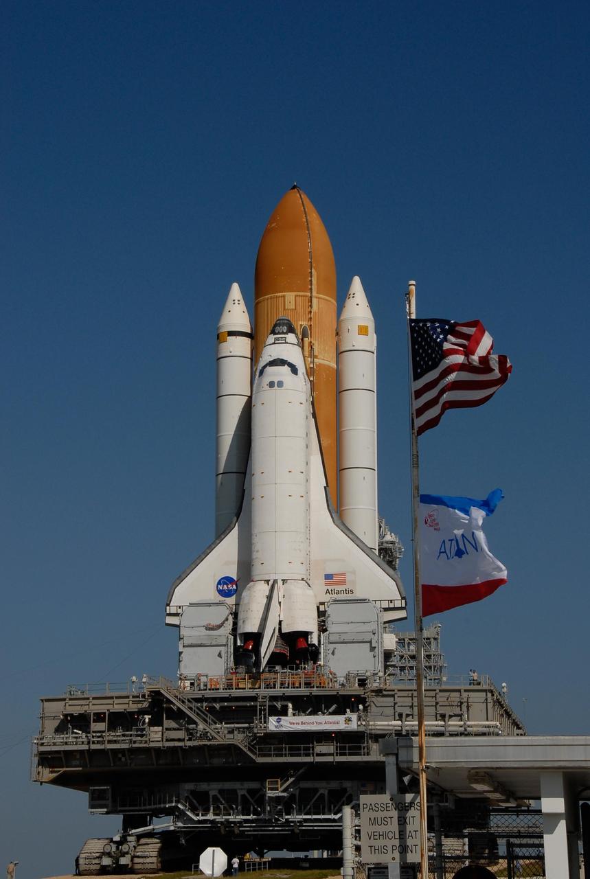 KENNEDY SPACE CENTER, FLA. -- Space Shuttle Atlantis, secured atop a mobile launch platform, approaches Launch Pad 39A on a breezy Florida morning. First motion out of the Vehicle Assembly Building was at 4:43 a.m. EST, and the shuttle was hard down on the pad at 11:51 a.m. Rollout is a milestone for Atlantis' launch to the International Space Station on mission STS-122, targeted for Dec. 6. On this mission, Atlantis will deliver the Columbus module to the International Space Station. The European Space Agency's largest contribution to the station, Columbus is a multifunctional, pressurized laboratory that will be permanently attached to U.S. Node 2, called Harmony. The module is approximately 23 feet long and 15 feet wide, allowing it to hold 10 large racks of experiments. The laboratory will expand the research facilities aboard the station, providing crew members and scientists from around the world the ability to conduct a variety of experiments in the physical, materials and life sciences. Photo credit: NASA/Kim Shiflett