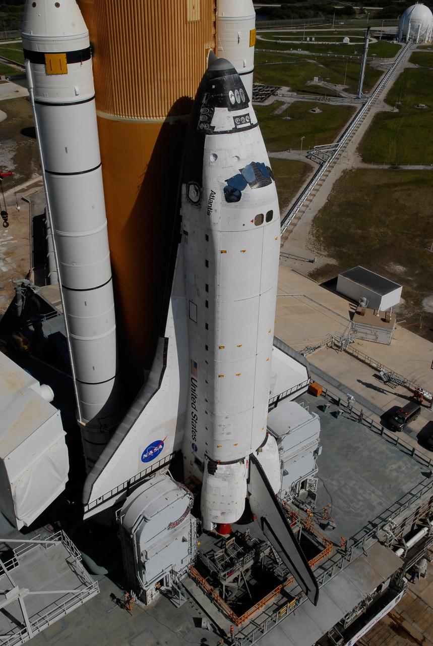 KENNEDY SPACE CENTER, FLA. -- Processing begins on Space Shuttle Atlantis upon its arrival at Launch Pad 39A. First motion out of the Vehicle Assembly Building was at 4:43 a.m. EST, and the shuttle was hard down on the pad at 11:51 a.m. Rollout is a milestone for Atlantis' launch to the International Space Station on mission STS-122, targeted for Dec. 6. On this mission, Atlantis will deliver the Columbus module to the International Space Station. The European Space Agency's largest contribution to the station, Columbus is a multifunctional, pressurized laboratory that will be permanently attached to U.S. Node 2, called Harmony. The module is approximately 23 feet long and 15 feet wide, allowing it to hold 10 large racks of experiments. The laboratory will expand the research facilities aboard the station, providing crew members and scientists from around the world the ability to conduct a variety of experiments in the physical, materials and life sciences. Photo credit: NASA/Kim Shiflett