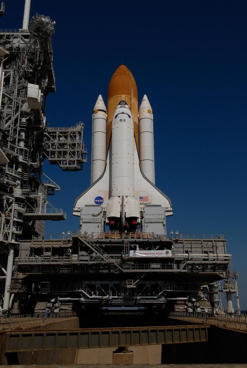 KENNEDY SPACE CENTER, FLA. -- Space Shuttle Atlantis and the mobile launch platform on which it is secured are positioned over the flame trench at Launch Pad 39A. First motion out of the Vehicle Assembly Building was at 4:43 a.m. EST, and the shuttle was hard down on the pad at 11:51 a.m. Rollout is a milestone for Atlantis' launch to the International Space Station on mission STS-122, targeted for Dec. 6. On this mission, Atlantis will deliver the Columbus module to the International Space Station. The European Space Agency's largest contribution to the station, Columbus is a multifunctional, pressurized laboratory that will be permanently attached to U.S. Node 2, called Harmony. The module is approximately 23 feet long and 15 feet wide, allowing it to hold 10 large racks of experiments. The laboratory will expand the research facilities aboard the station, providing crew members and scientists from around the world the ability to conduct a variety of experiments in the physical, materials and life sciences. Photo credit: NASA/Kim Shiflett