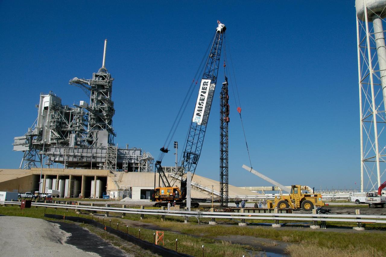 KENNEDY SPACE CENTER, FLA. -- On Launch Pad 39B at NASA's Kennedy Space Center, the crane crawler lifts a piling off a truck. The piling will be pounded into the ground to help construct lightning towers for the Constellation Program and Ares/Orion launches. Pad B will be the site of the first Ares vehicle launch, including Ares I-X which is scheduled for April 2009. Photo credit: NASA/George Shelton