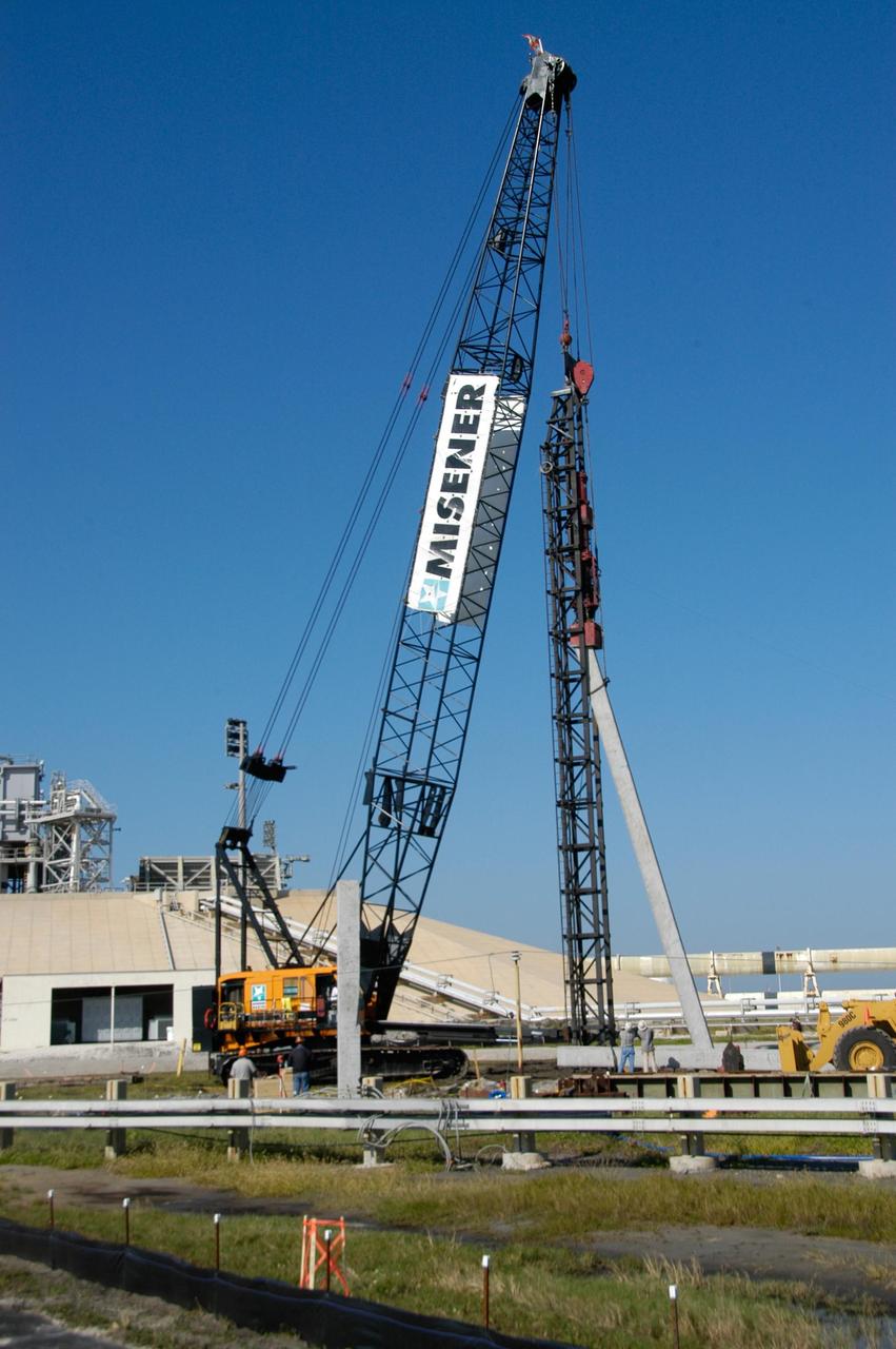 KENNEDY SPACE CENTER, FLA. -- On Launch Pad 39B at NASA's Kennedy Space Center, the crane crawler lifts a piling off a truck. The piling will be pounded into the ground to help construct lightning towers for the Constellation Program and Ares/Orion launches. Pad B will be the site of the first Ares vehicle launch, including Ares I-X which is scheduled for April 2009. Photo credit: NASA/George Shelton