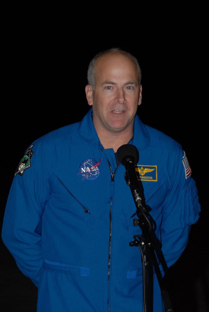 KENNEDY SPACE CENTER, FLA. --  Space shuttle Atlantis STS-122 Pilot Alan Poindexter talks to the media at Kennedy Space Center's Shuttle Landing Facility following his arrival to participate in three days of terminal countdown demonstration test, or TCDT, activities. The TCDT provides astronauts and ground crews with equipment familiarization, emergency egress training and a simulated launch countdown. On mission STS-122, Atlantis will deliver the Columbus module to the International Space Station. The European Space Agency's largest single contribution to the station, Columbus is a multifunctional, pressurized laboratory that will be permanently attached to U.S. Node 2, called Harmony. The laboratory will expand the research facilities aboard the station, providing crew members and scientists from around the world the ability to conduct a variety of experiments in the physical, materials and life sciences. Photo credit: NASA/George Shelton