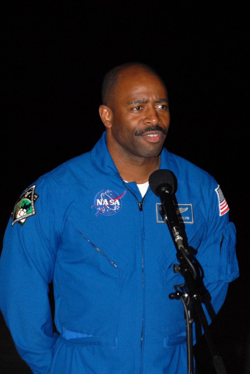 KENNEDY SPACE CENTER, FLA. --  Space shuttle Atlantis STS-122 Mission Specialist Leland Melvin talks to the media at Kennedy Space Center's Shuttle Landing Facility following his arrival to participate in three days of terminal countdown demonstration test, or TCDT, activities.  The TCDT provides astronauts and ground crews with equipment familiarization, emergency egress training and a simulated launch countdown. On mission STS-122, Atlantis will deliver the Columbus module to the International Space Station. The European Space Agency's largest single contribution to the station, Columbus is a multifunctional, pressurized laboratory that will be permanently attached to U.S. Node 2, called Harmony. The laboratory will expand the research facilities aboard the station, providing crew members and scientists from around the world the ability to conduct a variety of experiments in the physical, materials and life sciences. Photo credit: NASA/George Shelton