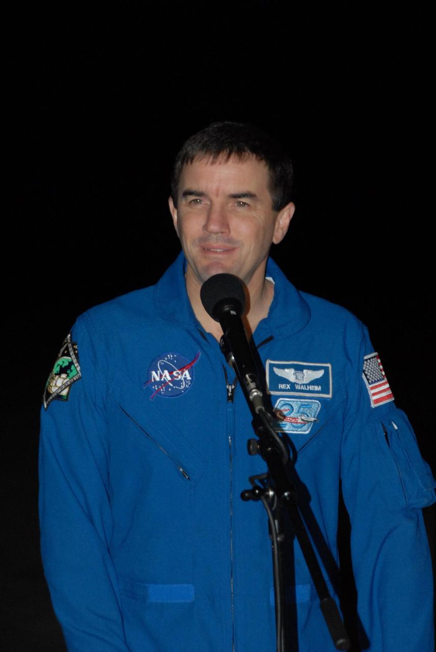 KENNEDY SPACE CENTER, FLA. --  Space shuttle Atlantis STS-122 Mission Specialist Rex Walheim talks to the media at Kennedy Space Center's Shuttle Landing Facility following his arrival to participate in three days of terminal countdown demonstration test, or TCDT, activities.  The TCDT provides astronauts and ground crews with equipment familiarization, emergency egress training and a simulated launch countdown. On mission STS-122, Atlantis will deliver the Columbus module to the International Space Station. The European Space Agency's largest single contribution to the station, Columbus is a multifunctional, pressurized laboratory that will be permanently attached to U.S. Node 2, called Harmony. The laboratory will expand the research facilities aboard the station, providing crew members and scientists from around the world the ability to conduct a variety of experiments in the physical, materials and life sciences. Photo credit: NASA/George Shelton