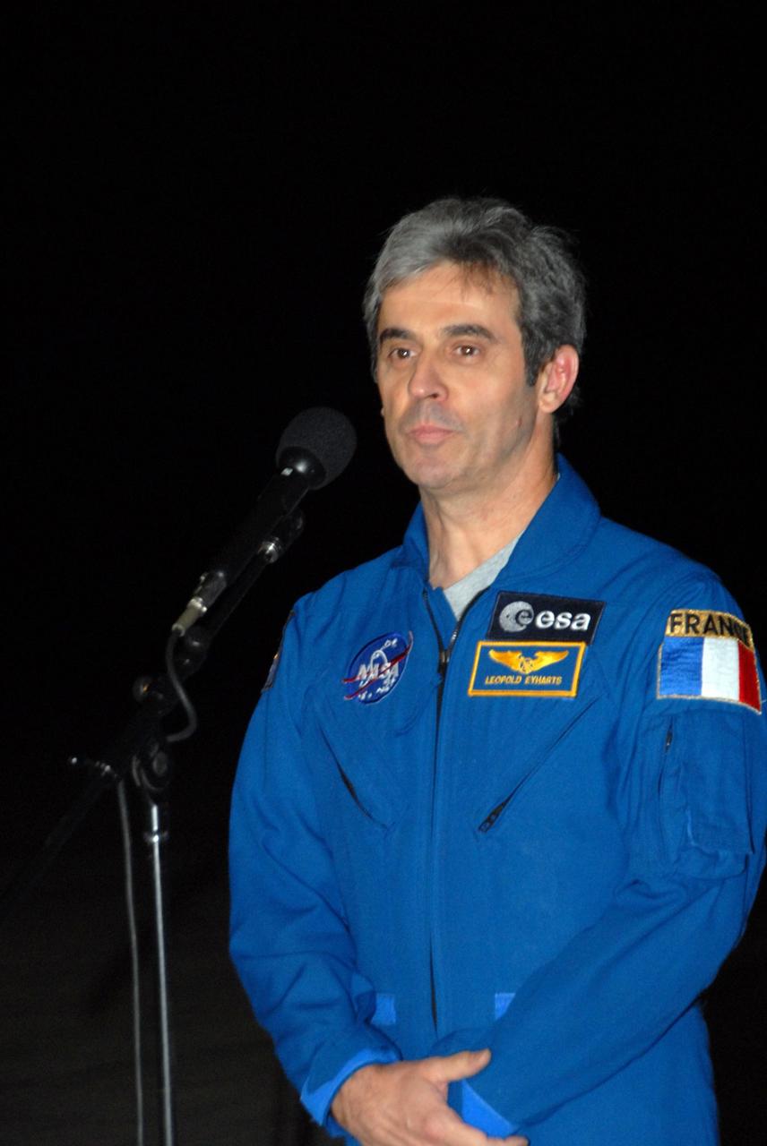 KENNEDY SPACE CENTER, FLA. --  Space shuttle Atlantis STS-122 Mission Specialist Leopold Eyharts, of the European Space Agency, talks to the media at Kennedy Space Center's Shuttle Landing Facility following his arrival to participate in three days of terminal countdown demonstration test, or TCDT, activities.  Eyharts will remain on the International Space Station as a flight engineer for Expedition 16 following the STS-122 mission.  The TCDT provides astronauts and ground crews with equipment familiarization, emergency egress training and a simulated launch countdown. On mission STS-122, Atlantis will deliver the Columbus module to the International Space Station. The European Space Agency's largest single contribution to the station, Columbus is a multifunctional, pressurized laboratory that will be permanently attached to U.S. Node 2, called Harmony. The laboratory will expand the research facilities aboard the station, providing crew members and scientists from around the world the ability to conduct a variety of experiments in the physical, materials and life sciences. Photo credit: NASA/George Shelton