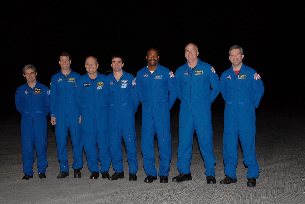 KENNEDY SPACE CENTER, FLA. --  The astronauts assigned to the space shuttle Atlantis STS-122 crew arrive at Kennedy Space Center's Shuttle Landing Facility aboard a Gulfstream shuttle training aircraft to participate in three days of terminal countdown demonstration test, or TCDT, activities.  From left are Mission Specialist Leopold Eyharts, a European Space Agency astronaut who will remain on the International Space Station as a flight engineer for Expedition 16; Mission Specialists Stanley Love, Hans Schlegel of the European Space Agency, Rex Walheim and Leland Melvin; Pilot Alan Poindexter; and Commander Steve Frick.  The TCDT provides astronauts and ground crews with equipment familiarization, emergency egress training and a simulated launch countdown. On mission STS-122, Atlantis will deliver the Columbus module to the International Space Station. The European Space Agency's largest single contribution to the station, Columbus is a multifunctional, pressurized laboratory that will be permanently attached to U.S. Node 2, called Harmony. The laboratory will expand the research facilities aboard the station, providing crew members and scientists from around the world the ability to conduct a variety of experiments in the physical, materials and life sciences. Photo credit: NASA/George Shelton