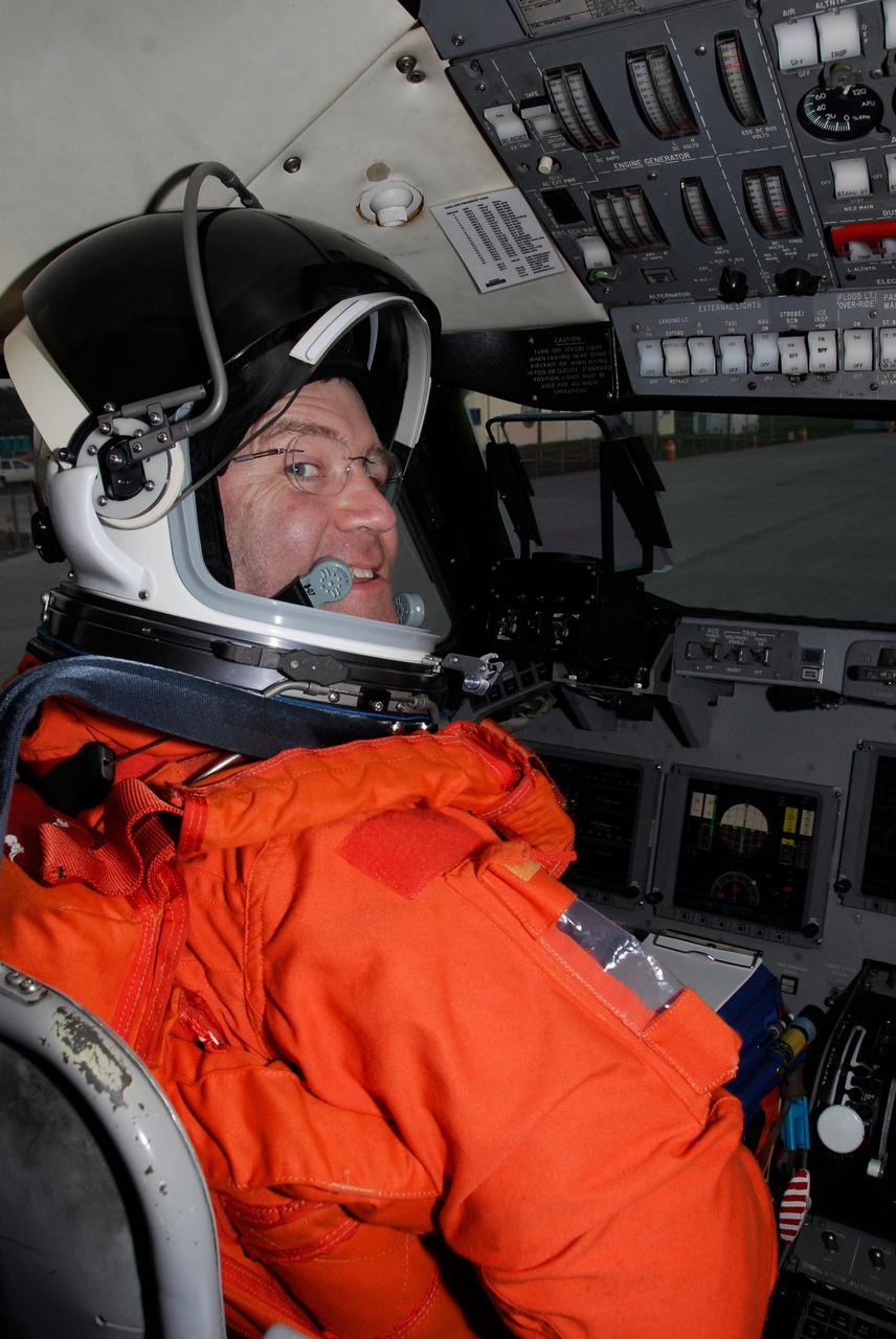 KENNEDY SPACE CENTER, FLA. -- Space shuttle Atlantis STS-122 Commander Steve Frick prepares to practice shuttle landings. He is sitting in the cockpit of a shuttle training aircraft, or STA, at Kennedy Space Center's Shuttle Landing Facility. The STA is a Grumman American Aviation-built Gulf Stream II jet that was modified to simulate an orbiter's cockpit, motion and visual cues, and handling qualities. In flight, the STA duplicates the orbiter's atmospheric descent trajectory from approximately 35,000 feet altitude to landing on a runway. Because the orbiter is unpowered during re-entry and landing, its high-speed glide must be perfectly executed the first time. The training is part of terminal countdown demonstration test, or TCDT, activities. The TCDT provides astronauts and ground crews with equipment familiarization, emergency egress training and a simulated launch countdown. On mission STS-122, Atlantis will deliver the European Space Agency's Columbus module to the International Space Station. Columbus is a multifunctional, pressurized laboratory that will be permanently attached to U.S. Node 2, called Harmony, and will expand the research facilities aboard the station. Launch is targeted for Dec. 6. Photo credit: NASA/Kim Shiflett