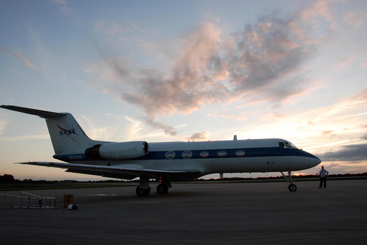KENNEDY SPACE CENTER, FLA. -- A shuttle training aircraft, or STA, sits on the tarmac at Kennedy Space Center's Shuttle Landing Facility at dusk, ready for practice flights by space shuttle Atlantis STS-122 Commander Steve Frick and Pilot Alan Poindexter. The STA is a Grumman American Aviation-built Gulf Stream II jet that was modified to simulate an orbiter's cockpit, motion and visual cues, and handling qualities. In flight, the STA duplicates the orbiter's atmospheric descent trajectory from approximately 35,000 feet altitude to landing on a runway. Because the orbiter is unpowered during re-entry and landing, its high-speed glide must be perfectly executed the first time. The training is part of terminal countdown demonstration test, or TCDT, activities. The TCDT provides astronauts and ground crews with equipment familiarization, emergency egress training and a simulated launch countdown. On mission STS-122, Atlantis will deliver the European Space Agency's Columbus module to the International Space Station. Columbus is a multifunctional, pressurized laboratory that will be permanently attached to U.S. Node 2, called Harmony, and will expand the research facilities aboard the station. Launch is targeted for Dec. 6. Photo credit: NASA/Kim Shiflett