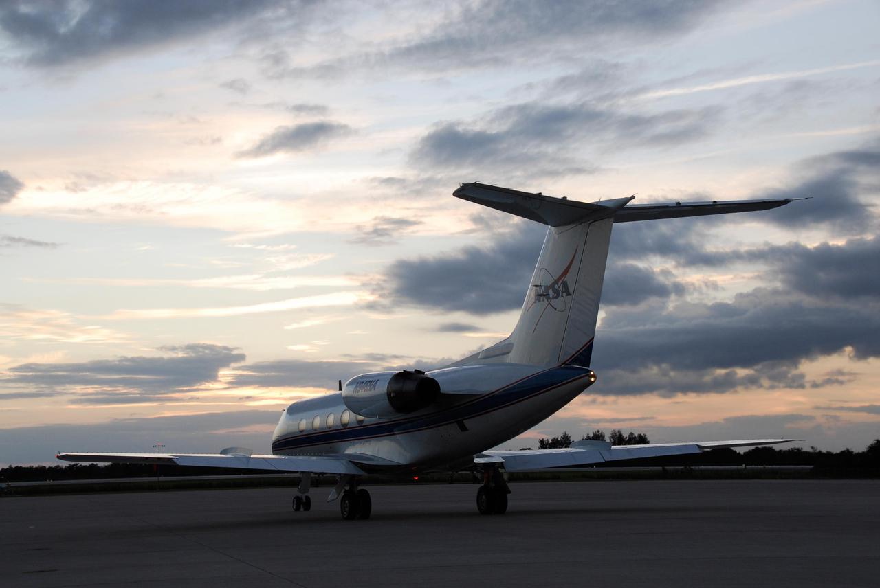 KENNEDY SPACE CENTER, FLA. -- A shuttle training aircraft, or STA, prepares for takeoff from Kennedy Space Center's Shuttle Landing Facility at dusk. The STA is being used for practice flights by space shuttle Atlantis STS-122 Commander Steve Frick and Pilot Alan Poindexter. The STA is a Grumman American Aviation-built Gulf Stream II jet that was modified to simulate an orbiter's cockpit, motion and visual cues, and handling qualities. In flight, the STA duplicates the orbiter's atmospheric descent trajectory from approximately 35,000 feet altitude to landing on a runway. Because the orbiter is unpowered during re-entry and landing, its high-speed glide must be perfectly executed the first time. The training is part of terminal countdown demonstration test, or TCDT, activities. The TCDT provides astronauts and ground crews with equipment familiarization, emergency egress training and a simulated launch countdown. On mission STS-122, Atlantis will deliver the European Space Agency's Columbus module to the International Space Station. Columbus is a multifunctional, pressurized laboratory that will be permanently attached to U.S. Node 2, called Harmony, and will expand the research facilities aboard the station. Launch is targeted for Dec. 6. Photo credit: NASA/Kim Shiflett