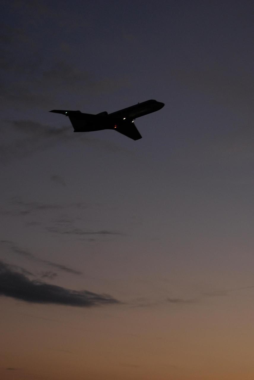 KENNEDY SPACE CENTER, FLA. -- A shuttle training aircraft, or STA, takes off from Kennedy Space Center's Shuttle Landing Facility at dusk. The STA is being used for practice flights by space shuttle Atlantis STS-122 Commander Steve Frick and Pilot Alan Poindexter. The STA is a Grumman American Aviation-built Gulf Stream II jet that was modified to simulate an orbiter's cockpit, motion and visual cues, and handling qualities. In flight, the STA duplicates the orbiter's atmospheric descent trajectory from approximately 35,000 feet altitude to landing on a runway. Because the orbiter is unpowered during re-entry and landing, its high-speed glide must be perfectly executed the first time. The training is part of terminal countdown demonstration test, or TCDT, activities. The TCDT provides astronauts and ground crews with equipment familiarization, emergency egress training and a simulated launch countdown. On mission STS-122, Atlantis will deliver the European Space Agency's Columbus module to the International Space Station. Columbus is a multifunctional, pressurized laboratory that will be permanently attached to U.S. Node 2, called Harmony, and will expand the research facilities aboard the station. Launch is targeted for Dec. 6. Photo credit: NASA/Kim Shiflett