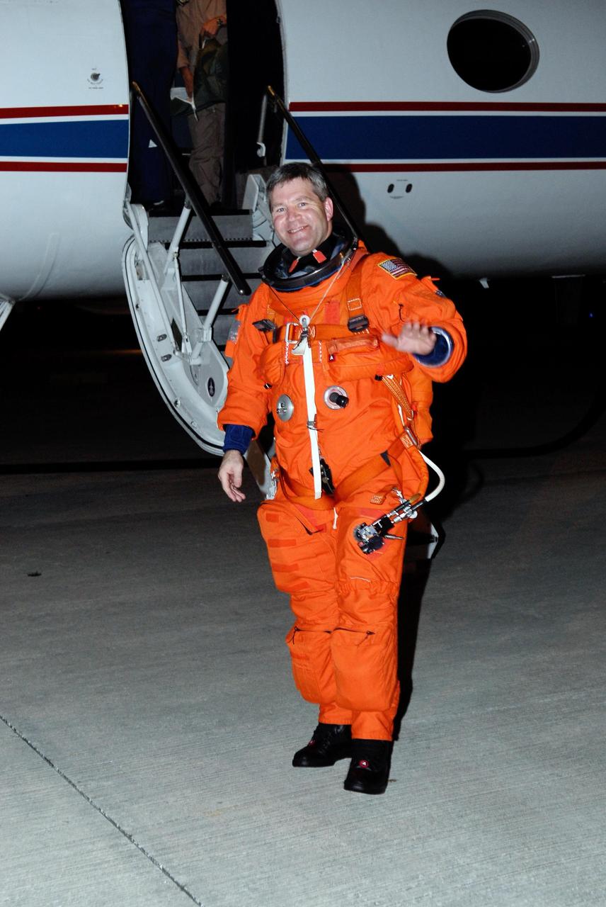 KENNEDY SPACE CENTER, FLA. -- Space shuttle Atlantis STS-122 Commander Steve Frick seems pleased with the practice session he has just completed aboard a shuttle training aircraft, or STA, at Kennedy Space Center's Shuttle Landing Facility. He and STS-122 Pilot Alan Poindexter were practicing landing the STA in preparation for their upcoming mission. The STA is a Grumman American Aviation-built Gulf Stream II jet that was modified to simulate an orbiter's cockpit, motion and visual cues, and handling qualities. In flight, the STA duplicates the orbiter's atmospheric descent trajectory from approximately 35,000 feet altitude to landing on a runway. Because the orbiter is unpowered during re-entry and landing, its high-speed glide must be perfectly executed the first time. The training is part of terminal countdown demonstration test, or TCDT, activities. The TCDT provides astronauts and ground crews with equipment familiarization, emergency egress training and a simulated launch countdown. On mission STS-122, Atlantis will deliver the European Space Agency's Columbus module to the International Space Station. Columbus is a multifunctional, pressurized laboratory that will be permanently attached to U.S. Node 2, called Harmony, and will expand the research facilities aboard the station. Launch is targeted for Dec. 6. Photo credit: NASA/Kim Shiflett