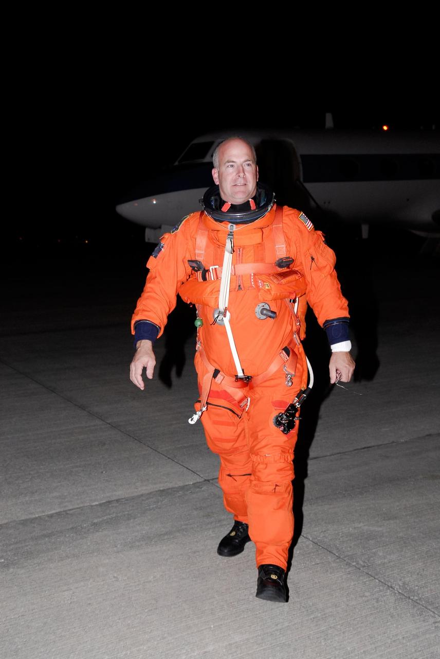 KENNEDY SPACE CENTER, FLA. -- Space shuttle Atlantis STS-122 Pilot Alan Poindexter seems satisfied with the practice session he has just completed aboard a shuttle training aircraft, or STA, at Kennedy Space Center's Shuttle Landing Facility. He and STS-122 Commander Steve Frick were practicing landing the STA in preparation for their upcoming mission. The STA is a Grumman American Aviation-built Gulf Stream II jet that was modified to simulate an orbiter's cockpit, motion and visual cues, and handling qualities. In flight, the STA duplicates the orbiter's atmospheric descent trajectory from approximately 35,000 feet altitude to landing on a runway. Because the orbiter is unpowered during re-entry and landing, its high-speed glide must be perfectly executed the first time. The training is part of terminal countdown demonstration test, or TCDT, activities. The TCDT provides astronauts and ground crews with equipment familiarization, emergency egress training and a simulated launch countdown. On mission STS-122, Atlantis will deliver the European Space Agency's Columbus module to the International Space Station. Columbus is a multifunctional, pressurized laboratory that will be permanently attached to U.S. Node 2, called Harmony, and will expand the research facilities aboard the station. Launch is targeted for Dec. 6. Photo credit: NASA/Kim Shiflett
