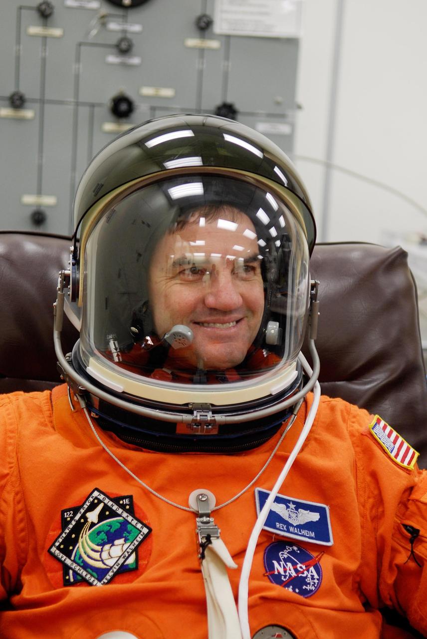 KENNEDY SPACE CENTER, FLA. -- Space shuttle Atlantis STS-122 Mission Specialist Rex Walheim is fully attired in his launch and entry suit, in astronaut crew quarters. The STS-122 crew is preparing for a simulated launch countdown aboard Atlantis, part of terminal countdown demonstration test, or TCDT, activities at NASA's Kennedy Space Center. The TCDT is a dress rehearsal for launch and also provides astronauts and ground crews with equipment familiarization and emergency egress training. On mission STS-122, Atlantis will deliver the Columbus module to the International Space Station. The European Space Agency's largest single contribution to the station, Columbus is a multifunctional, pressurized laboratory that will be permanently attached to U.S. Node 2, called Harmony. The laboratory will expand the research facilities aboard the station, providing crew members and scientists from around the world the ability to conduct a variety of experiments in the physical, materials and life sciences. Launch is targeted for Dec. 6. Photo credit: NASA/Kim Shiflett