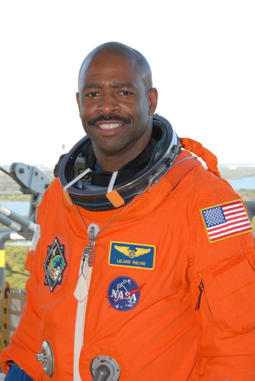 KENNEDY SPACE CENTER, FLA. --  Space shuttle Atlantis STS-122 Mission Specialist Leland Melvin arrives at Launch Pad 39A, dressed in his launch and entry suit, to participate in a simulated launch countdown aboard Atlantis.   The exercise is part of terminal countdown demonstration test, or TCDT, activities at NASA's Kennedy Space Center. The TCDT is a dress rehearsal for launch and also provides astronauts and ground crews with equipment familiarization and emergency egress training.  On mission STS-122, Atlantis will deliver the Columbus module to the International Space Station. The European Space Agency's largest single contribution to the station, Columbus is a multifunctional, pressurized laboratory that will be permanently attached to U.S. Node 2, called Harmony. The laboratory will expand the research facilities aboard the station, providing crew members and scientists from around the world the ability to conduct a variety of experiments in the physical, materials and life sciences. Atlantis' launch is targeted for Dec. 6.  Photo credit: NASA/George Shelton