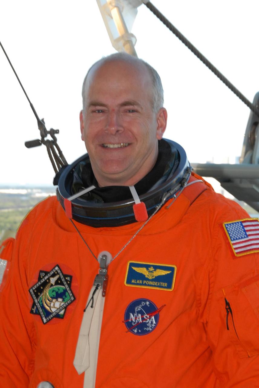 KENNEDY SPACE CENTER, FLA. --  Space shuttle Atlantis STS-122 Pilot Alan Poindexter arrives at Launch Pad 39A, dressed in his launch and entry suit, to participate in a simulated launch countdown aboard Atlantis.   The exercise is part of terminal countdown demonstration test, or TCDT, activities at NASA's Kennedy Space Center. The TCDT is a dress rehearsal for launch and also provides astronauts and ground crews with equipment familiarization and emergency egress training.  On mission STS-122, Atlantis will deliver the Columbus module to the International Space Station. The European Space Agency's largest single contribution to the station, Columbus is a multifunctional, pressurized laboratory that will be permanently attached to U.S. Node 2, called Harmony. The laboratory will expand the research facilities aboard the station, providing crew members and scientists from around the world the ability to conduct a variety of experiments in the physical, materials and life sciences. Atlantis' launch is targeted for Dec. 6.  Photo credit: NASA/George Shelton