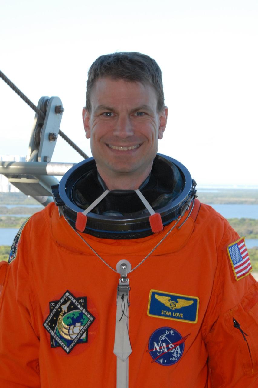 KENNEDY SPACE CENTER, FLA. --  Space shuttle Atlantis STS-122 Mission Specialist Stanley Love arrives at Launch Pad 39A, dressed in his launch and entry suit, to participate in a simulated launch countdown aboard Atlantis.   The exercise is part of terminal countdown demonstration test, or TCDT, activities at NASA's Kennedy Space Center. The TCDT is a dress rehearsal for launch and also provides astronauts and ground crews with equipment familiarization and emergency egress training.  On mission STS-122, Atlantis will deliver the Columbus module to the International Space Station. The European Space Agency's largest single contribution to the station, Columbus is a multifunctional, pressurized laboratory that will be permanently attached to U.S. Node 2, called Harmony. The laboratory will expand the research facilities aboard the station, providing crew members and scientists from around the world the ability to conduct a variety of experiments in the physical, materials and life sciences. Atlantis' launch is targeted for Dec. 6.  Photo credit: NASA/George Shelton