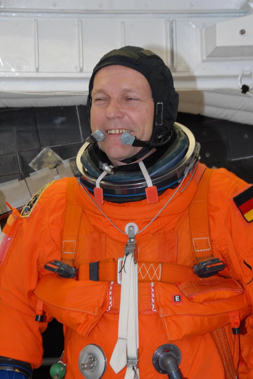 KENNEDY SPACE CENTER, FLA. --  In the White Room on Launch Pad 39A, space shuttle Atlantis STS-122 Mission Specialist Hans Schlegel prepares for his entry onto Atlantis' flight deck.  Schlegel is with the European Space Agency.   The exercise is part of terminal countdown demonstration test, or TCDT, activities at NASA's Kennedy Space Center. The TCDT is a dress rehearsal for launch and also provides astronauts and ground crews with equipment familiarization and emergency egress training.  On mission STS-122, Atlantis will deliver the Columbus module to the International Space Station. The European Space Agency's largest single contribution to the station, Columbus is a multifunctional, pressurized laboratory that will be permanently attached to U.S. Node 2, called Harmony. The laboratory will expand the research facilities aboard the station, providing crew members and scientists from around the world the ability to conduct a variety of experiments in the physical, materials and life sciences. Atlantis' launch is targeted for Dec. 6.  Photo credit: NASA/George Shelton
