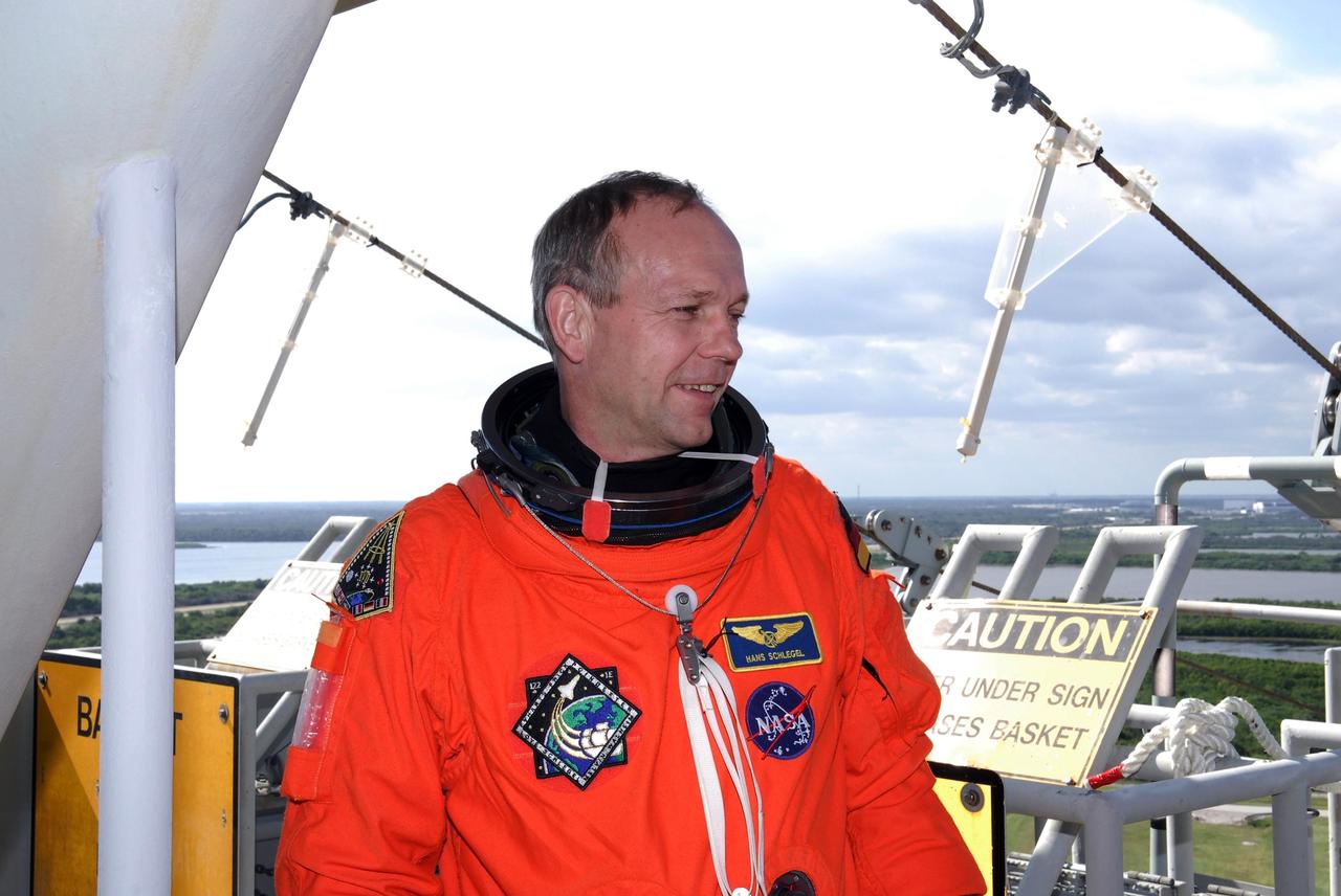 KENNEDY SPACE CENTER, FLA. --  Space shuttle Atlantis STS-122 Mission Specialist Hans Schlegel relaxes for a moment following a simulated launch countdown at Launch Pad 39A.   The exercise is part of terminal countdown demonstration test, or TCDT, activities at NASA's Kennedy Space Center. The TCDT is a dress rehearsal for launch and also provides astronauts and ground crews with equipment familiarization and emergency egress training.  On mission STS-122, Atlantis will deliver the Columbus module to the International Space Station. The European Space Agency's largest single contribution to the station, Columbus is a multifunctional, pressurized laboratory that will be permanently attached to U.S. Node 2, called Harmony. The laboratory will expand the research facilities aboard the station, providing crew members and scientists from around the world the ability to conduct a variety of experiments in the physical, materials and life sciences. Atlantis' launch is targeted for Dec. 6.  Photo credit: NASA/Kim Shiflett