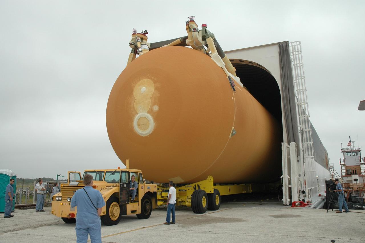 KENNEDY SPACE CENTER, FLA. -- At the Launch Complex 39 Area turn basin at NASA's Kennedy Space Center, the external tank is moved out of the Pegasus barge on a transporter. The tank will be used for space shuttle Endeavour's STS-123 mission. After offloading, the tank will be transported to the Vehicle Assembly Building. Endeavour is targeted for launch to the International Space Station on Feb. 14. Photo credit: NASA/Jim Grossmann