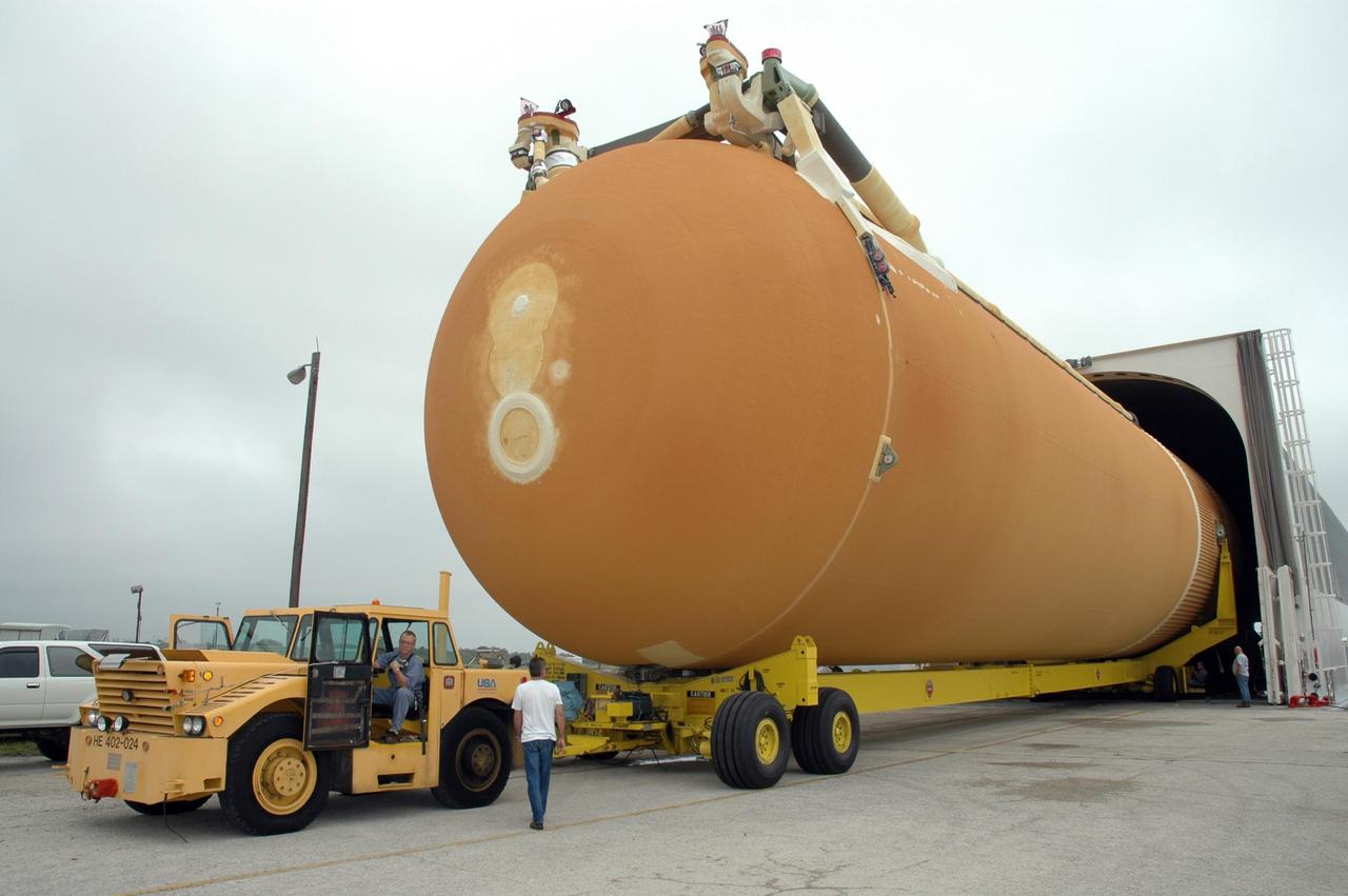 KENNEDY SPACE CENTER, FLA. -- At the Launch Complex 39 Area turn basin at NASA's Kennedy Space Center, the external tank is moved out of the Pegasus barge on a transporter. The tank will be used for space shuttle Endeavour's STS-123 mission. After offloading, the tank will be transported to the Vehicle Assembly Building. Endeavour is targeted for launch to the International Space Station on Feb. 14. Photo credit: NASA/Jim Grossmann