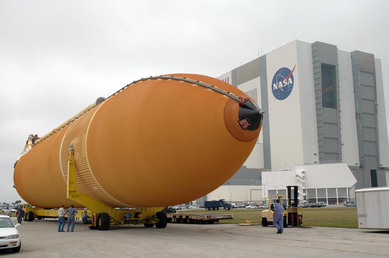 KENNEDY SPACE CENTER, FLA. -- After being offloaded from the Pegasus barge at the Launch Complex 39 Area turn basin at NASA's Kennedy Space Center, the external tank is being transported to the Vehicle Assembly Building, in the background. The tank will be used for space shuttle Endeavour's STS-123 mission. Endeavour is targeted for launch to the International Space Station on Feb. 14. Photo credit: NASA/Jim Grossmann