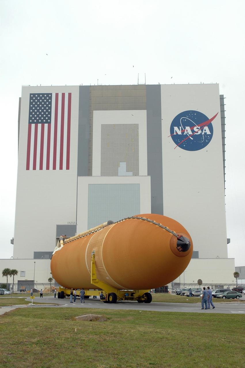 KENNEDY SPACE CENTER, FLA. -- The external tank for space shuttle Endeavour's STS-123 mission is maneuvered around a corner toward the Vehicle Assembly Building, in the background. The tank was shipped from NASA's Michoud Assembly Facility near New Orleans aboard the Pegasus barge. Endeavour is targeted for launch to the International Space Station on Feb. 14. Photo credit: NASA/Jim Grossmann