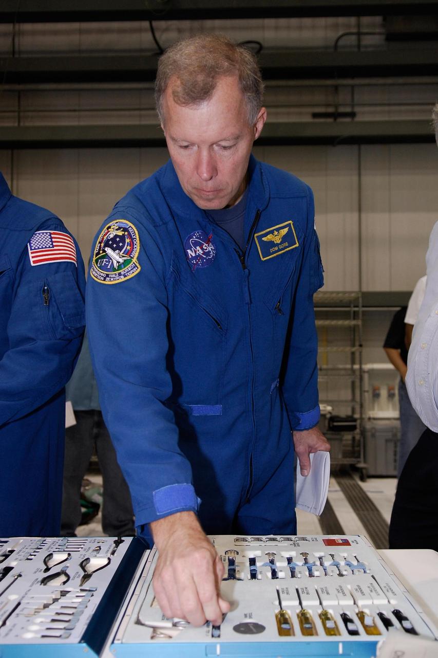 KENNEDY SPACE CENTER, FLA. --  In the Orbiter Processing Facility at NASA's Kennedy Space Center, space shuttle Endeavour's STS-123 Commander Dominic Gorie checks out tools that will be carried on the mission.  The crew is at Kennedy for crew equipment interface test, a process of familiarization with payloads, hardware and the space shuttle.  The STS-123 mission is targeted for launch on Feb. 14. It will be the 25th assembly flight of the station.  Photo credit: NASA/Kim Shiflett