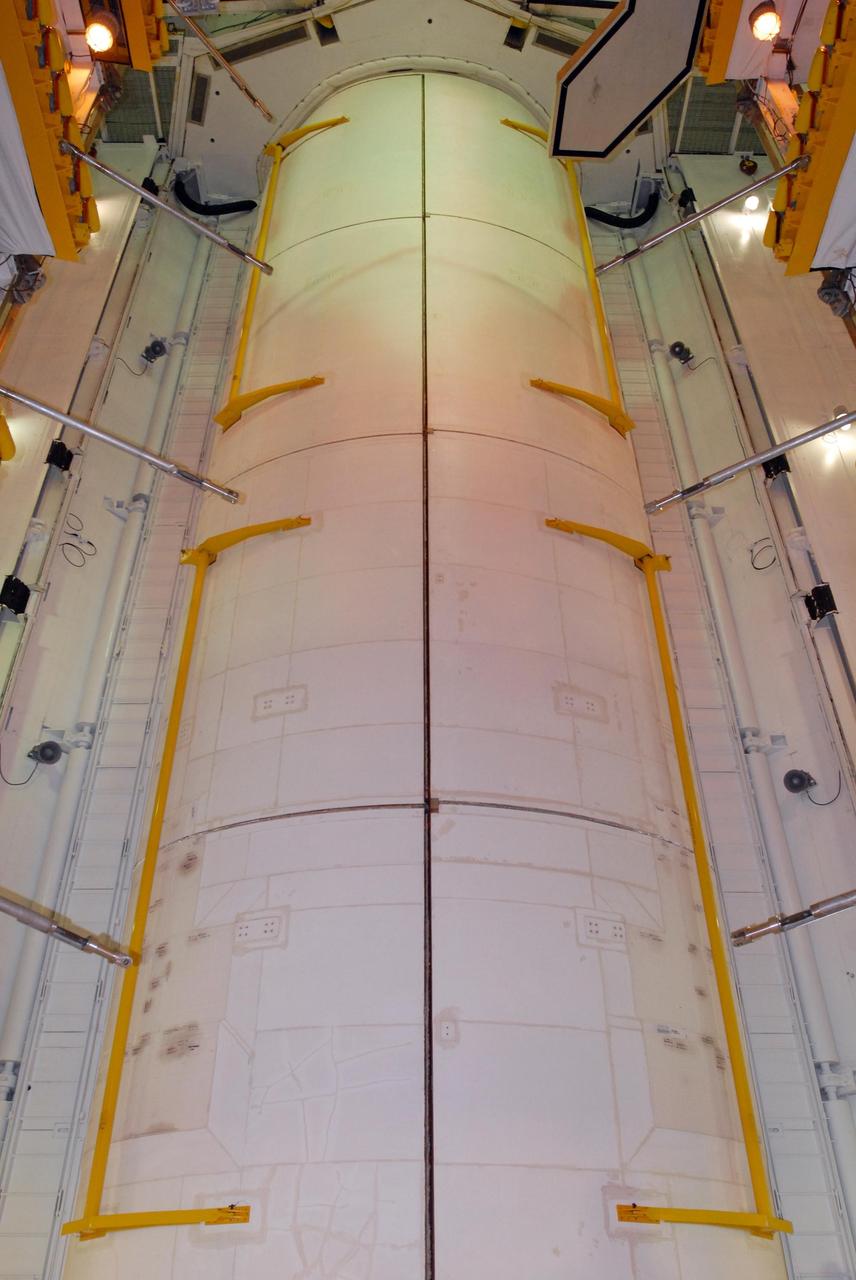 KENNEDY SPACE CENTER, FLA. -- On Launch Pad 39A, space shuttle Atlantis' payload bay doors are closed for launch. Inside are the Columbus Laboratory, the integrated cargo carrier - lite and the orbital docking system. Atlantis is being secured for launch on Dec. 6 on mission STS-122 to the International Space Station. The Columbus laboratory module, built by the European Space Agency, is approximately 23 feet long and 15 feet wide, allowing it to hold 10 large racks of experiments. The carrier holds three elements: a nitrogen tank assembly that is part of the external active thermal control system on the International Space Station, the European Technology Exposure Facility composed of nine science instruments and an autonomous temperature measurement unit, and the SOLAR payload designed for sun observation. Photo credit: NASA/George Shelton