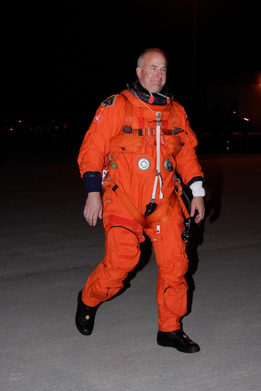 KENNEDY SPACE CENTER, FLA. --  Dressed in his launch and entry suit, STS-122 Pilot Alan Poindexter heads across the Shuttle Landing Facility at NASA's Kennedy Space Center to the shuttle training aircraft, or STA.  Poindexter and Commander Steve Frick will practice shuttle landings in the STA before the Dec. 6 launch on space shuttle Atlantis.  The STA is a Grumman American Aviation-built Gulf Stream II jet that was modified to simulate an orbiter's cockpit, motion and visual cues, and handling qualities.  Photo credit: NASA/Kim Shiflett