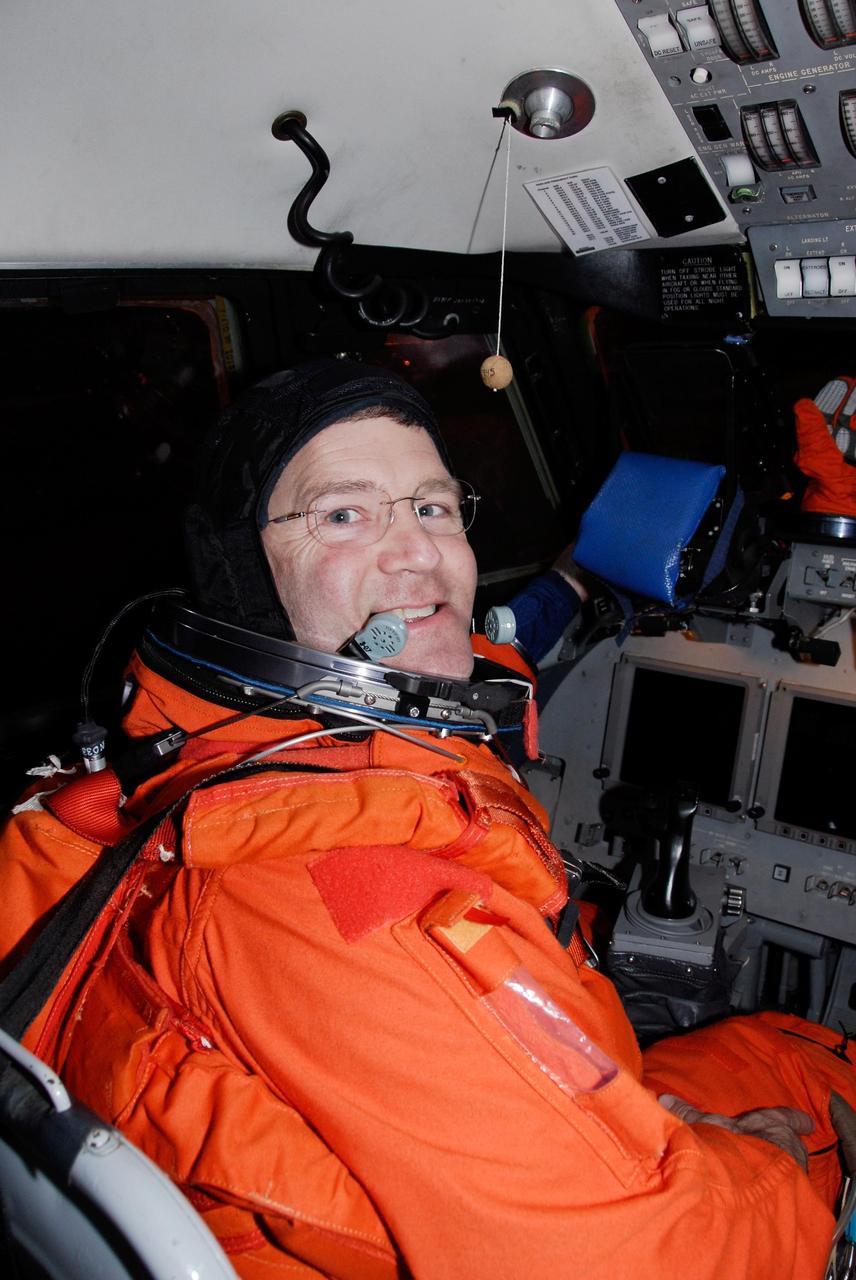 KENNEDY SPACE CENTER, FLA. --  Dressed in his launch and entry suit, STS-122 Commander Steve Frick is seated in the shuttle training aircraft, or STA, at NASA's Kennedy Space Center.  Frick and Pilot Alan Poindexter will practice shuttle landings in the STA before the Dec. 6 launch on space shuttle Atlantis.  The STA is a Grumman American Aviation-built Gulf Stream II jet that was modified to simulate an orbiter's cockpit, motion and visual cues, and handling qualities. Photo credit: NASA/Kim Shiflett
