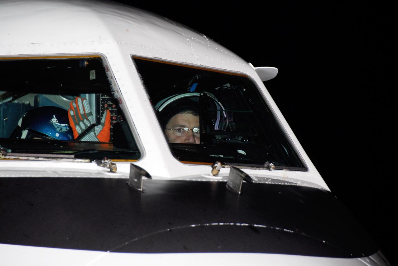 KENNEDY SPACE CENTER, FLA. --  STS-122 Commander Steve Frick waves from inside the cockpit of the shuttle training aircraft, or STA, at NASA's Kennedy Space Center.  Frick and Pilot Alan Poindexter will practice shuttle landings in the STA before the Dec. 6 launch on space shuttle Atlantis.  The STA is a Grumman American Aviation-built Gulf Stream II jet that was modified to simulate an orbiter's cockpit, motion and visual cues, and handling qualities.  Photo credit: NASA/Kim Shiflett