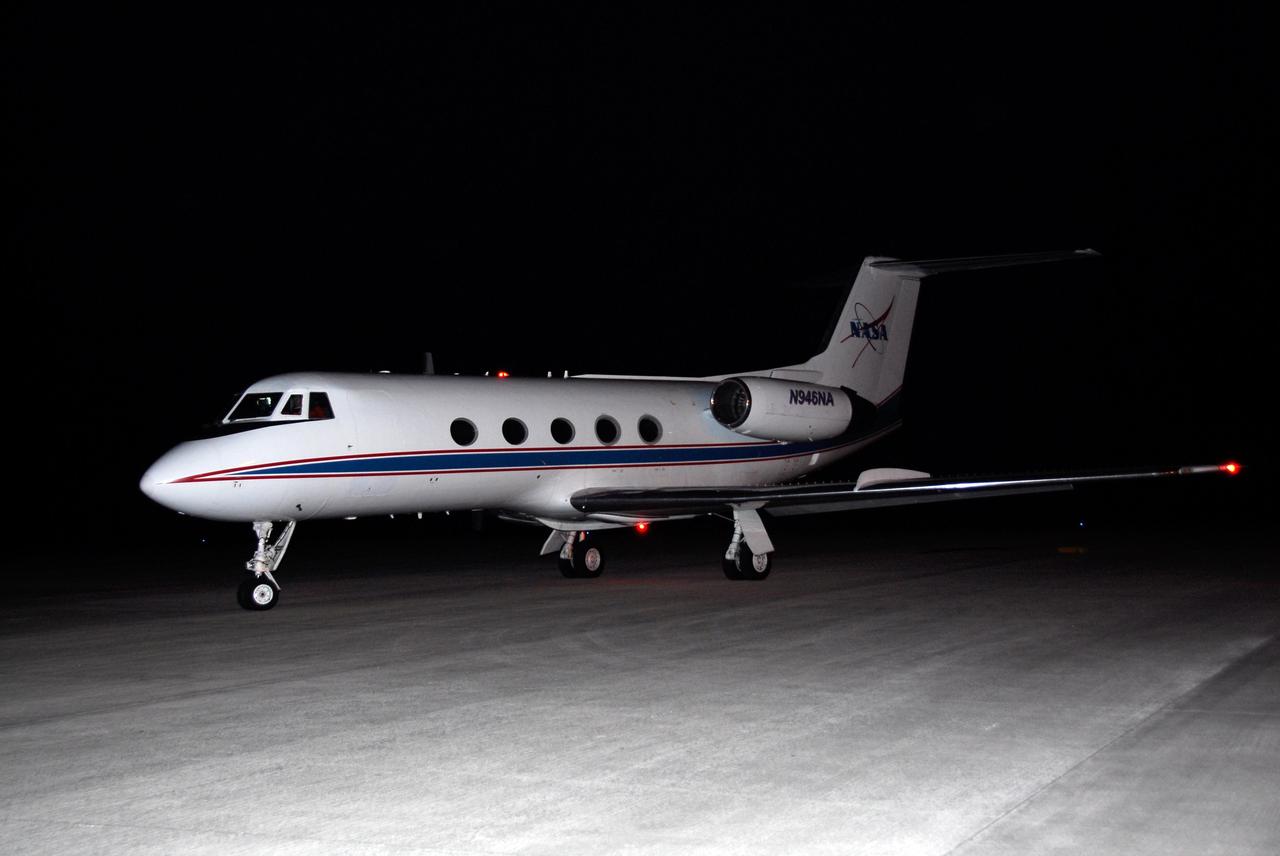 KENNEDY SPACE CENTER, FLA. --  On the Shuttle Landing Facility at NASA's Kennedy Space Center, the shuttle training aircraft, or STA, taxis toward the runway for practice landings.  In the cockpit are Commander Steve Frick and Pilot Alan Poindexter, who are preparing for the Dec. 6 launch on space shuttle Atlantis.  The STA is a Grumman American Aviation-built Gulf Stream II jet that was modified to simulate an orbiter's cockpit, motion and visual cues, and handling qualities.  Photo credit: NASA/Kim Shiflett