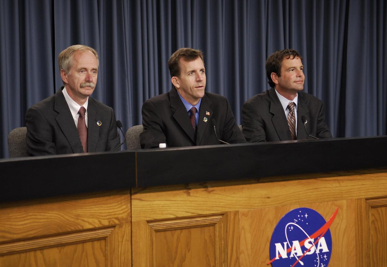 KENNEDY SPACE CENTER, FLA. --  Members of the Mission Management Team, or MMT, participate in a news briefing following the conclusion of the team's meeting.  The meeting followed the morning's launch scrub of the space shuttle Atlantis STS-122 mission caused by problems experienced with the external tank's engine cutoff sensor system during tanking for the second launch attempt.  From left are Bill Gerstenmaier, associate administrator for Space Operations; LeRoy Cain, MMT chairman; and Doug Lyons, STS-122 launch director.  An announcement was made during the briefing that the STS-122 launch is postponed to no earlier than Jan. 2, 2008, to give the team time to resolve the system's problems.  Atlantis will carry the Columbus Laboratory, the European Space Agency's largest contribution to the construction of the International Space Station. It will support scientific and technological research in a microgravity environment.  Permanently attached to the Harmony node of the space station, the laboratory will carry out experiments in materials science, fluid physics and biosciences, as well as perform a number of technological applications.  Photo credit: NASA/Kim Shiflett