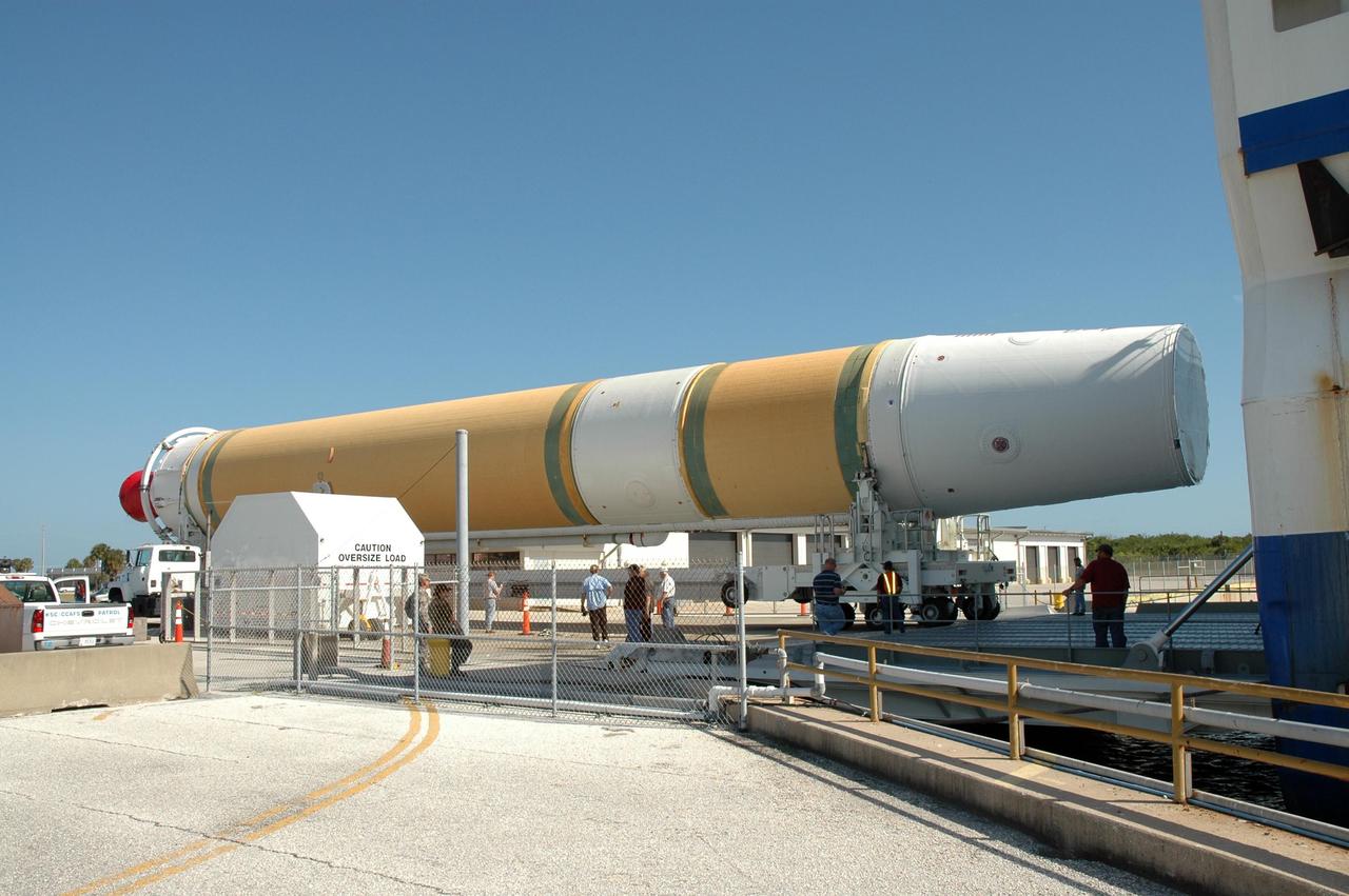 KENNEDY SPACE CENTER, FLA.  --  The Delta IV first stage that will be used to launch the GOES-O satellite has been offloaded on the dock on Cape Canaveral Air Force Station in Florida. It will be transported to Complex 37. The satellite is part of the series developed by the Geostationary Operational Environmental Satellite Program, a joint effort of NASA and the National Oceanic and Atmospheric Administration, known as NOAA. Currently, the GOES system consists of GOES-12 operating as GOES-East in the eastern part of the constellation at 75° west longitude, and GOES-10 operating as GOES-West at 135° west longitude. These spacecraft help meteorologists observe and predict local weather events, including thunderstorms, tornadoes, fog, flash floods, and other severe weather. In addition, GOES observations have proven helpful in monitoring dust storms, volcanic eruptions and forest fires.  GOES-O is targeted for launch on July 20 aboard a Boeing Delta IV rocket.  Photo credit: NASA/Jim Grossmann