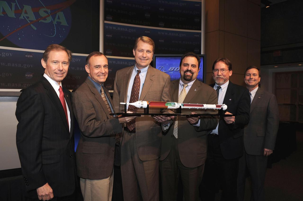 WASHINGTON, D.C. -- (From left) Brewster Shaw, vice president and genral manager of Boeing Space Exploration; Jeff Hanley, Constellation Program manager; Danny Davis, Upper Stage Element manager; Steve Cook, Ares Project manager; Doug Cooke, deputy associate administrator for Exploration Systems; and Rick Gilbrech, associate administrator for Space Exploration, stand with a model of the Ares I rocket on Dec. 12, 2007, at NASA Headquarters in Washington. NASA has selected The Boeing Company of Huntsville, Ala., as the prime contractor to produce, deliver and install avionics systsems for the Ares I rocket that will launch the Orion crew exploration vehicle into orbit. The selection is the final major contract award for Ares I. Photo credit: NASA/Paul E. Alers