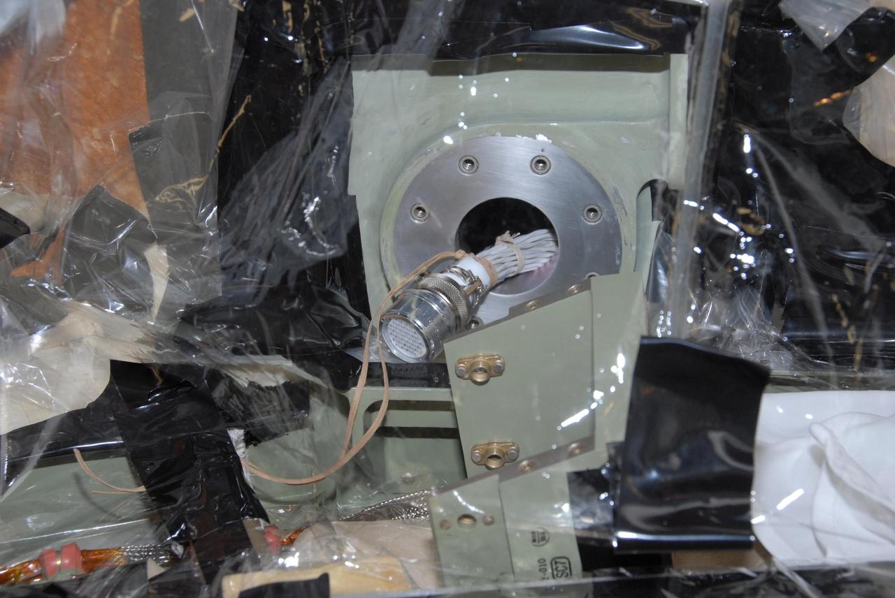 KENNEDY SPACE CENTER, FLA. --  This closeup shows the internal connector to which the replacement feed-through connector in the engine cutoff, or ECO, sensor system on space shuttle Atlantis' external tank will be installed. The feed-through connector passes the wires from the inside of the tank to the outside.  Results of a tanking test on Dec. 18 pointed to an open circuit in the feed-through connector wiring, which is located at the base of the tank. The pins in the replacement connector have been precisely soldered to create a connection that allows sensors inside the tank to send signals to the computers onboard Atlantis. The work is being done on Launch Pad 39A.   Space shuttle Atlantis is now targeted for launch on Feb. 7.  Photo credit: NASA/George Shelton