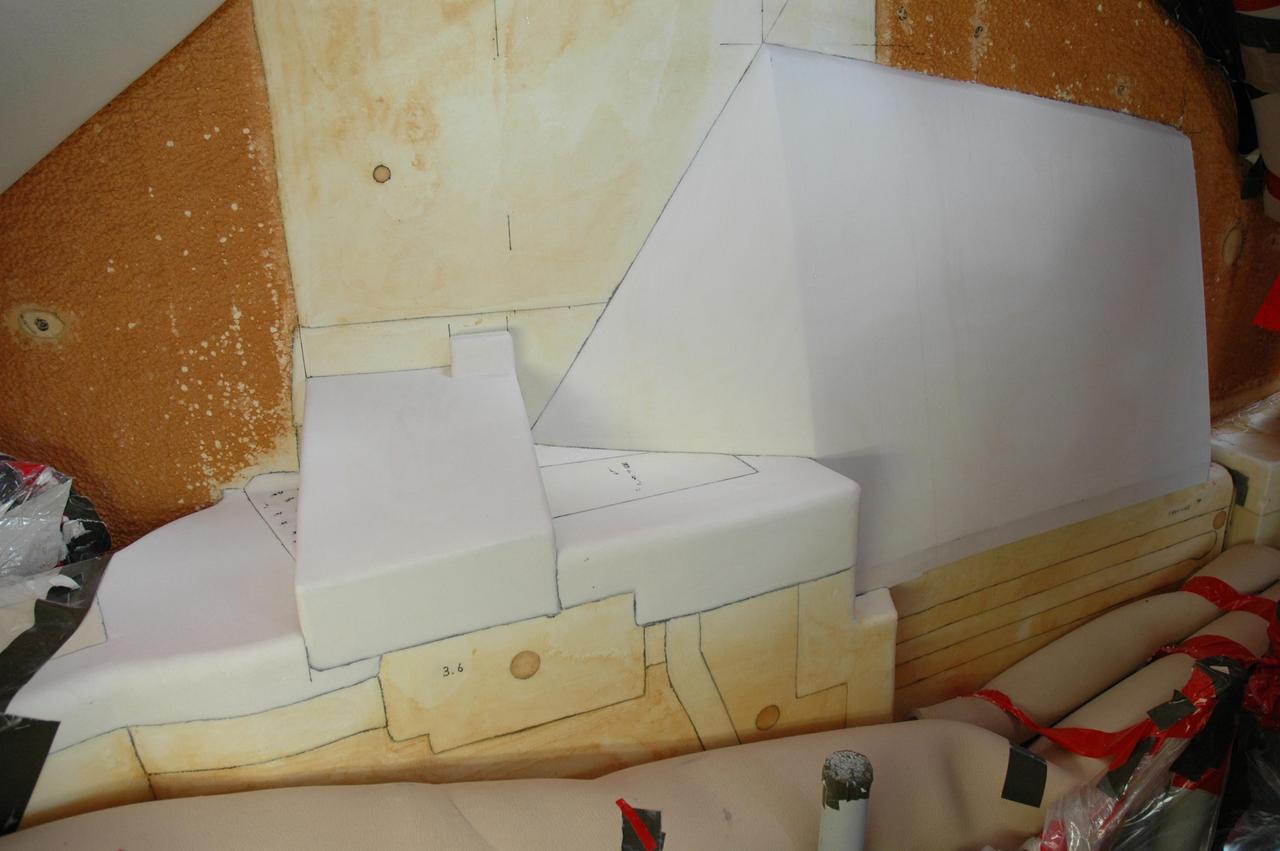 KENNEDY SPACE CENTER, FLA. --  The white foam insulation freshly reapplied to space shuttle Atlantis's external tank completes the work to remove and replace the feed-through connector on the engine cut-off, or ECO, sensor connector.  The repair work was done on Atlantis while the shuttle has been on Launch Pad 39A at NASA's Kennedy Space Center.   The foam was removed to enable engineers to remove and replace the ECO sensor connector on the tank.  The feed-through connector passes the wires from the inside of the tank to the outside.  Results of a tanking test on Dec. 18 pointed to an open circuit in the feed-through connector wiring, which is located at the base of the tank. The pins in the replacement connector were precisely soldered to create a connection that allows sensors inside the tank to send signals to the computers onboard Atlantis.  The repair work was done on Atlantis while the shuttle has been on Launch Pad 39A at NASA's Kennedy Space Center.  The launch date for the shuttle's STS-122 mission has now been targeted for Feb. 7.   Photo credit: NASA/Cory Husten