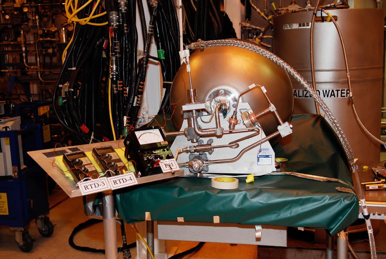 KENNEDY SPACE CENTER, FLA. -- In the hypergolic maintenance facility at NASA's Kennedy Space Center, some of the internal elements seen here of the ARES I-X Roll Control System, or RoCS, will undergo testing. The RoCS Servicing Simulation Test is to gather data that will be used to help certify the ground support equipment design and validate the servicing requirements and processes. The RoCS is part of the Interstage structure, the lowest axial segment of the Upper Stage Simulator. In an effort to reduce costs and meet the schedule, most of the ground support equipment that will be used for the RoCS servicing is of space shuttle heritage. This high-fidelity servicing simulation will provide confidence that servicing requirements can be met with the heritage system. At the same time, the test will gather process data that will be used to modify or refine the equipment and processes to be used for the actual flight element. Photo credit: NASA/Kim Shiflett